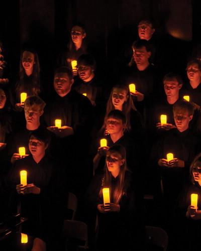 NWU Choir with candles during Christmas with Wesleyan. 