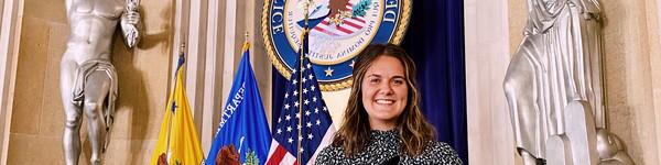 NWU female student at a podium in at the 律政司 in Washington D.C.