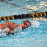 Kayla Helper swimming in a pool.